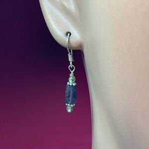 Sterling Silver dangle earrings with a black bead. 1.25 inches long